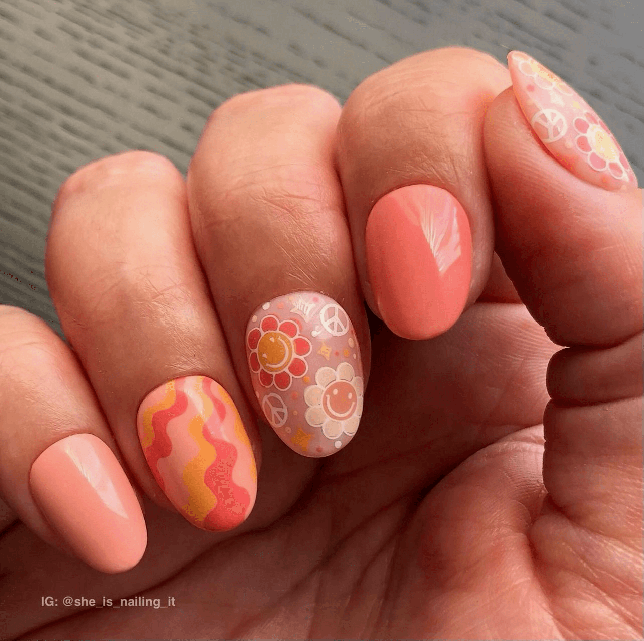stunning-manicure-with-nail-art-designs-of-waves-smiling-flowers-and-peace-signs