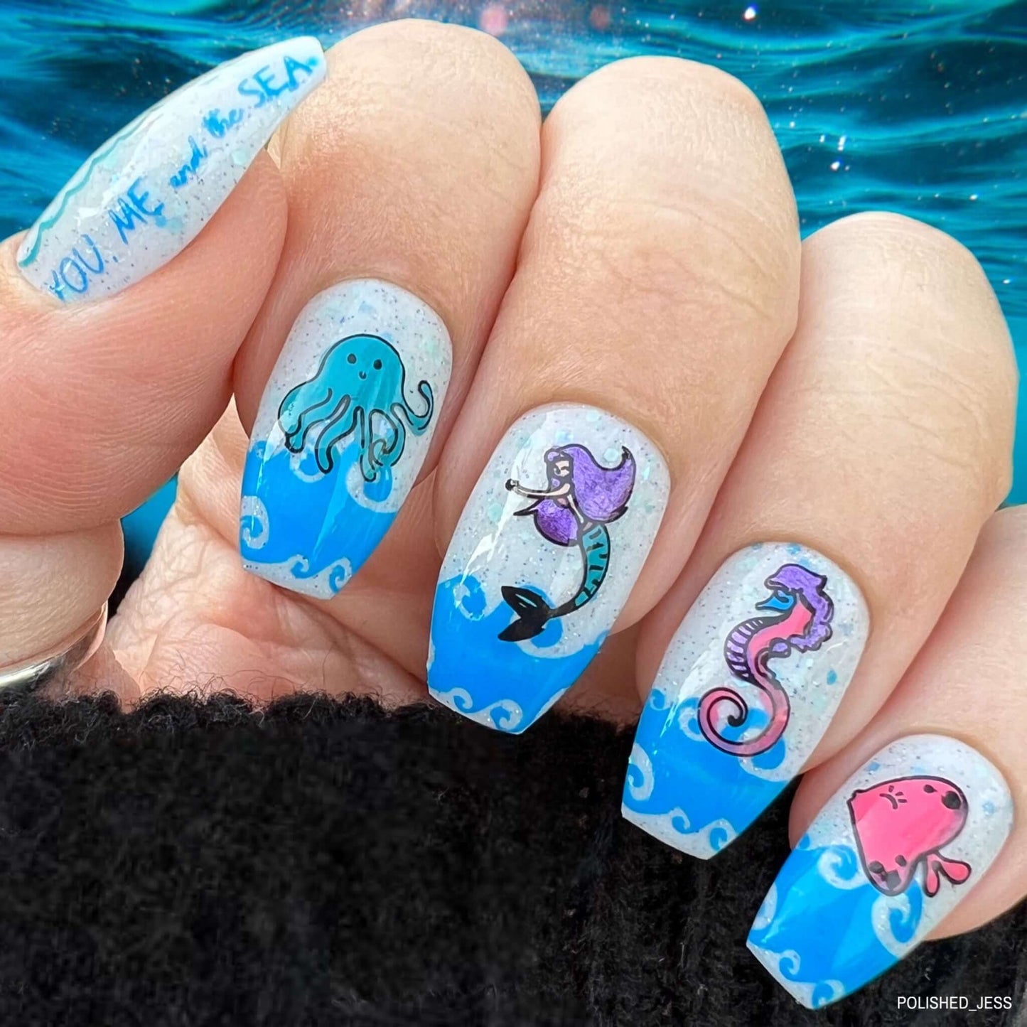 beautiful-manicure-with-nail-art-designs-of-a-mermaid-octopus-seahorse-and-fish-in-waves