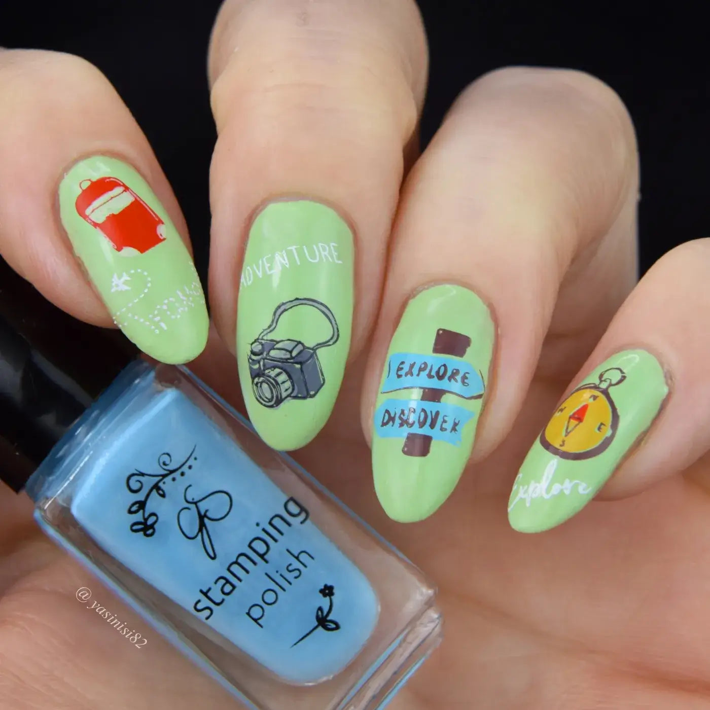 beautiful-manicure-showing-nail-art-designs-of-a-camera-compass