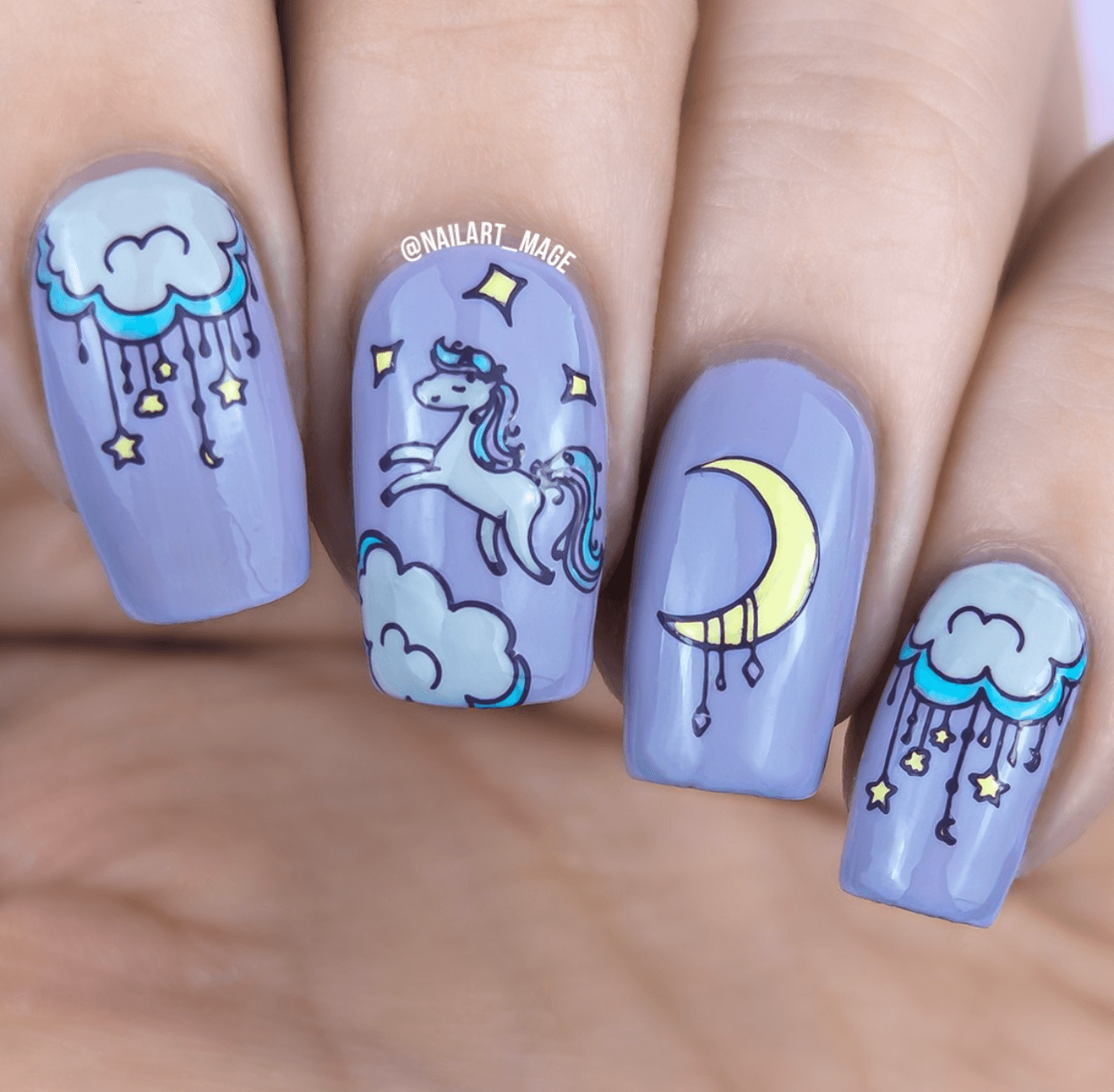 beautiful-purple-manicure-showing-nail-art-designs-of-a-unicorn-dream-catchers-and-a-moon