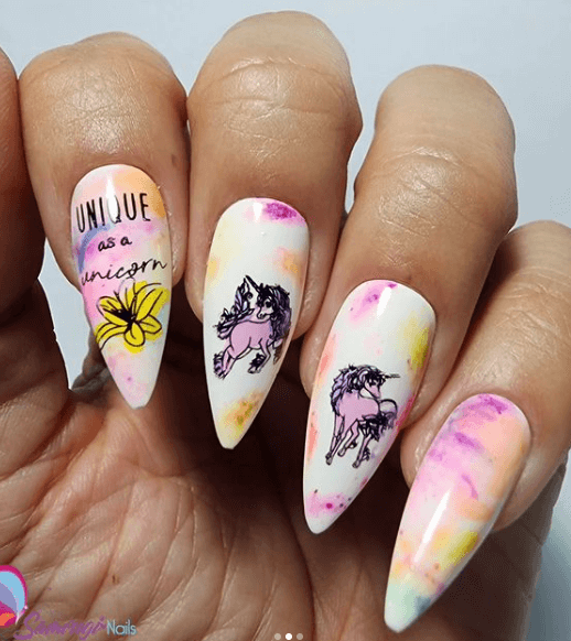 Beautiful-marble-manicure-showing-nail-art-designs-of-unicorns-and-words-unique-as-a-unicorn