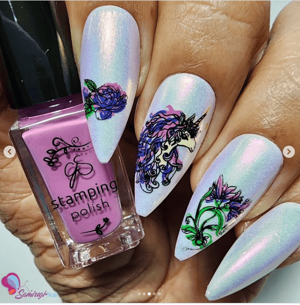 beautiful-manicure-showing-nail-art-designs-of-a-unicorn-with-flowers