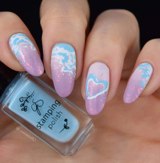 dreamy-manicure-showing-nail-art-designs-of-clouds-and-a-heart-cloud-with-a-bottle-of-clear-jelly-stamper-polish
