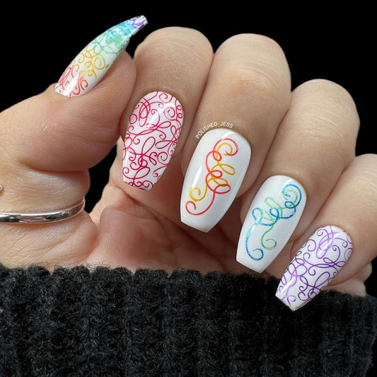 beautiful-manicured-hand-showing-nail-art-of-colorful-twirls-and-swirls