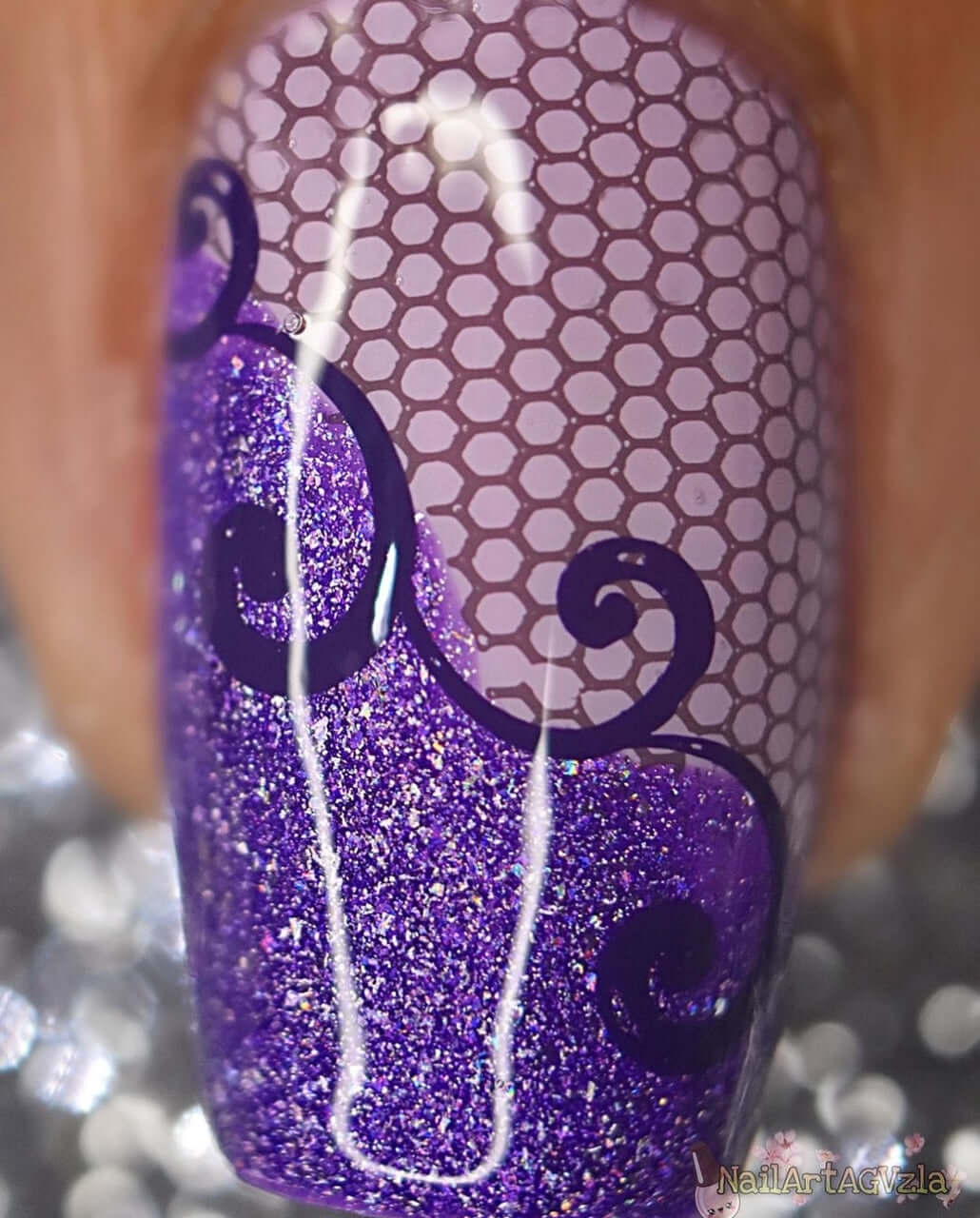 single-manicure-nail-with-a-nail-art-design-of-lace-and-swirl