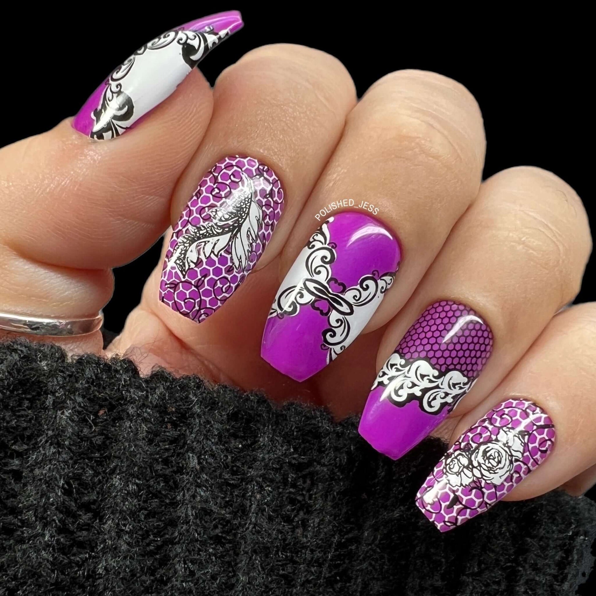 bold-purple-manicure-showing-nail-art-designs-of-lace-and-swirls