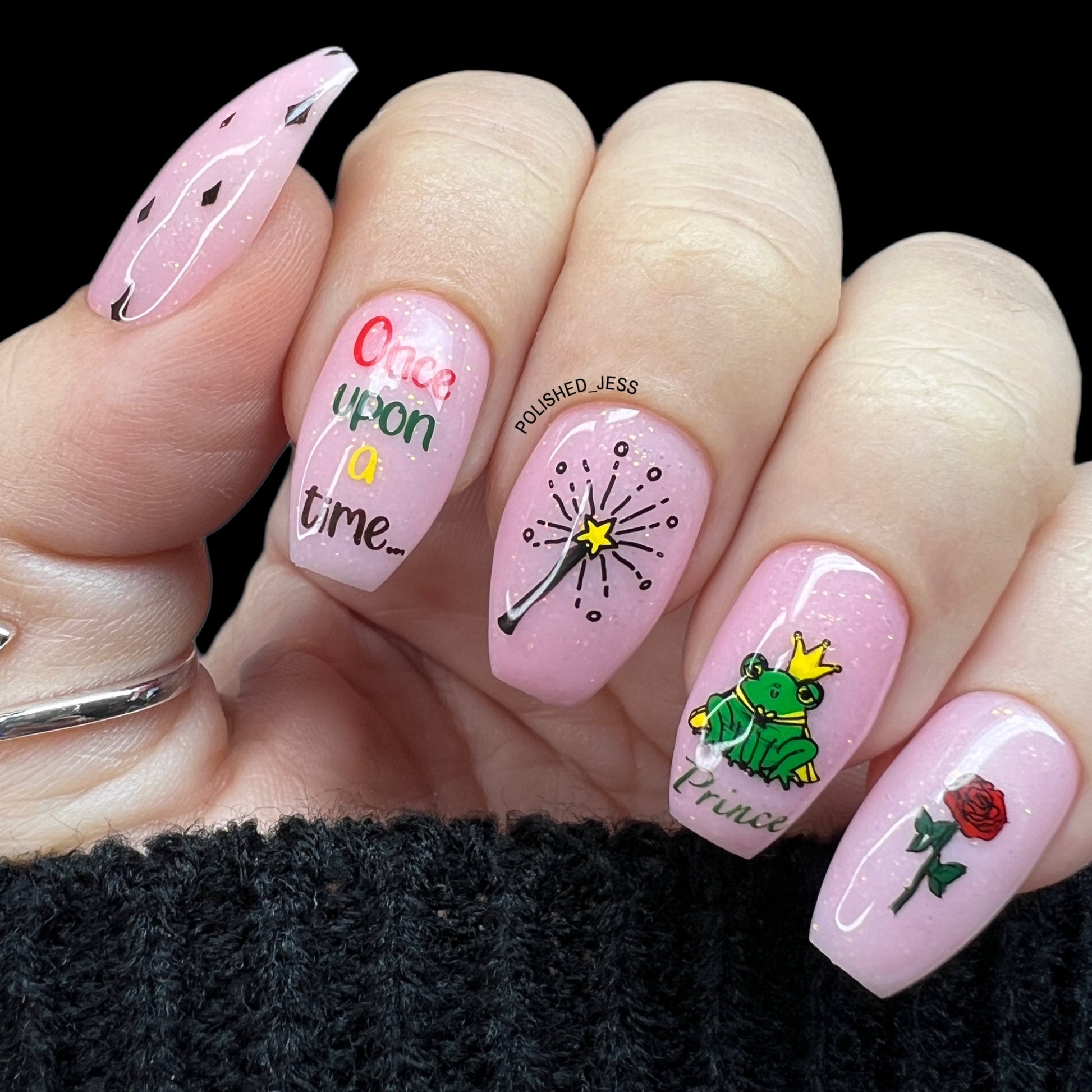 beautiful-manicure-with-fairy-tale-themed-nail-art-designs-of-a-frog-prince-a-rose-and-the-words-once-upon-a-time