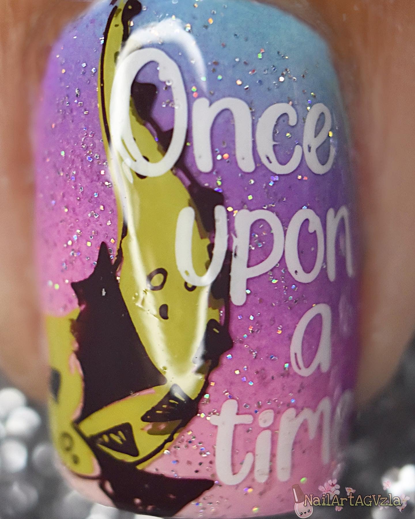 single-manicure-nail-showing-a-nail-art-design-of-a-dragon-and-the--words-once-upon-a-time