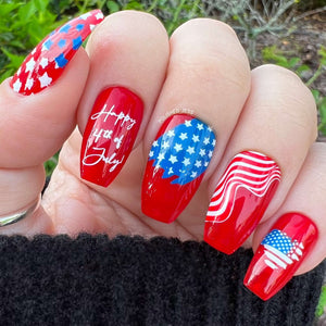 Bright-red-manicure-with-nail-art-saying-happy-4th-of-july-and-the-usa-flag