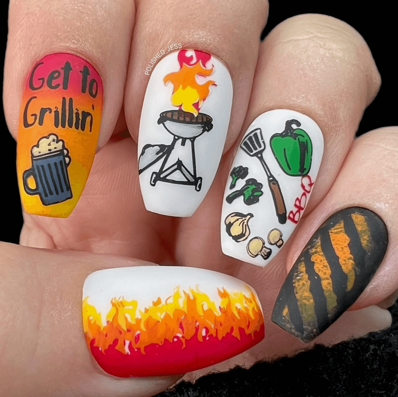 Manicure-showing-nail-art-designs-of-a-bbq-beer-vegtables-fire-and-the-words-get-to-grill'in