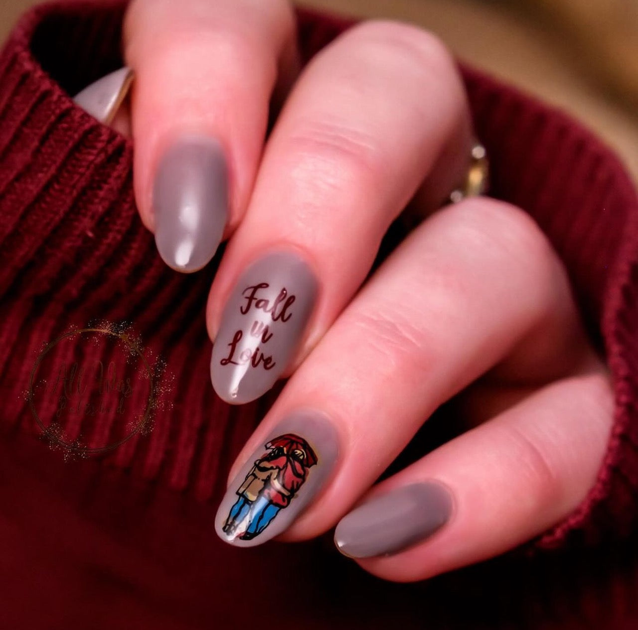 Gorgeous-manciure-with-a-nail-art-design-of-a-couple-under-an-umbrella-and-the-words-fall-in-love