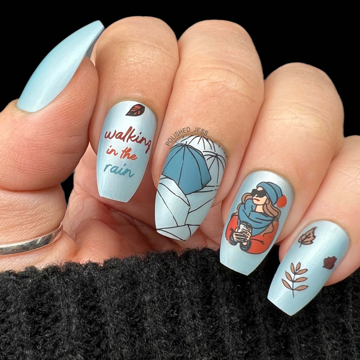 shimmery-manicure-showing-fall-themed-nail-art-designs-of-umbrellas-leaves-and-a-girl-with-a-coffee-cup