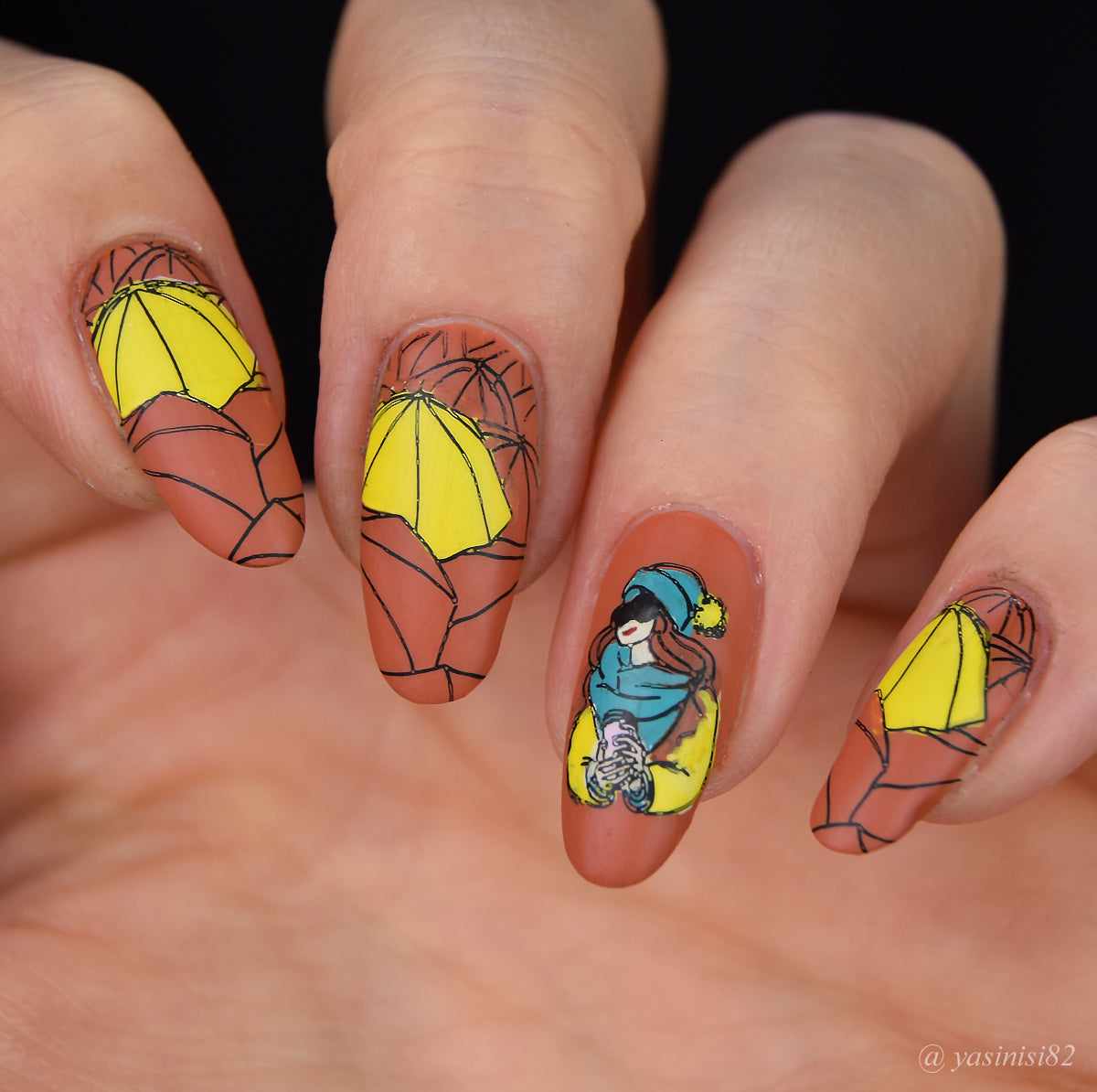 manicure-showing-fall-themed-nail-art-designs-of-umbrellas-leaves-and-a-girl-with-a-coffee-cup