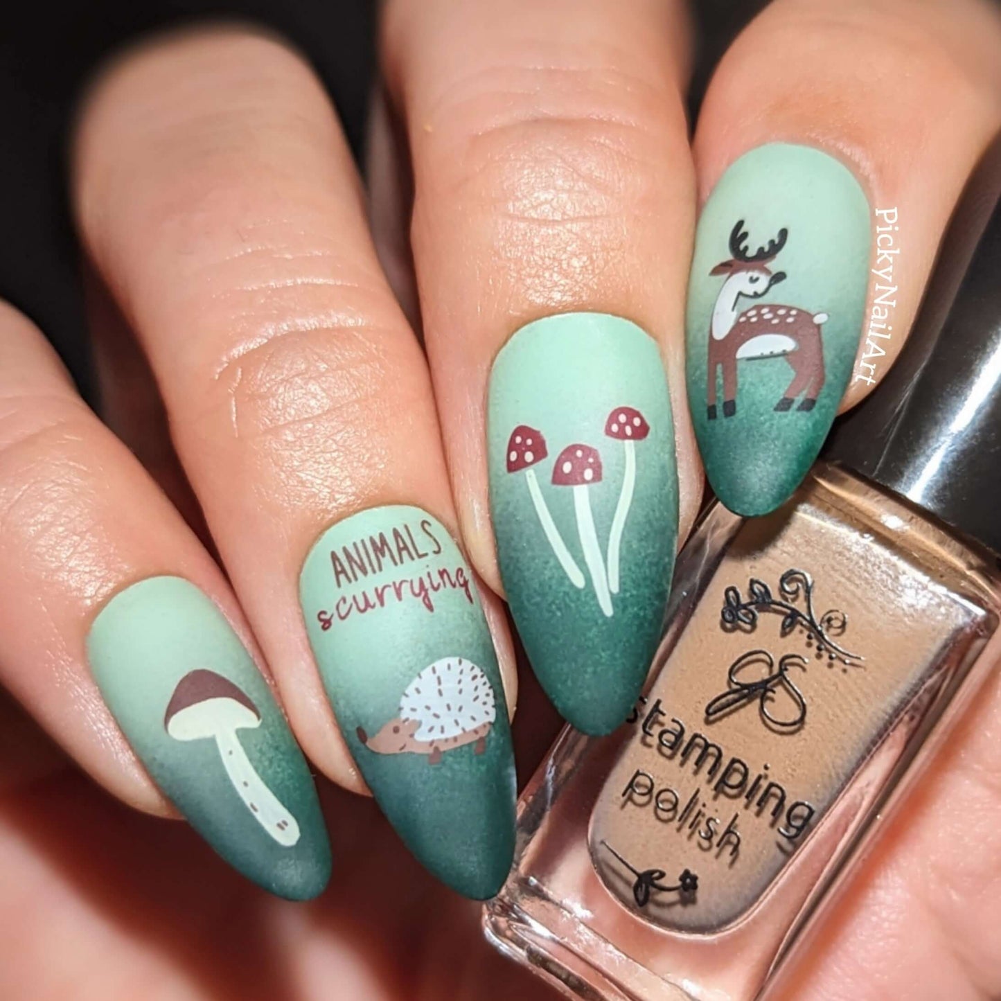 striking-manicure-showing-nail-art-designs-of-mushrooms-a-deer-and-a-hedgehog