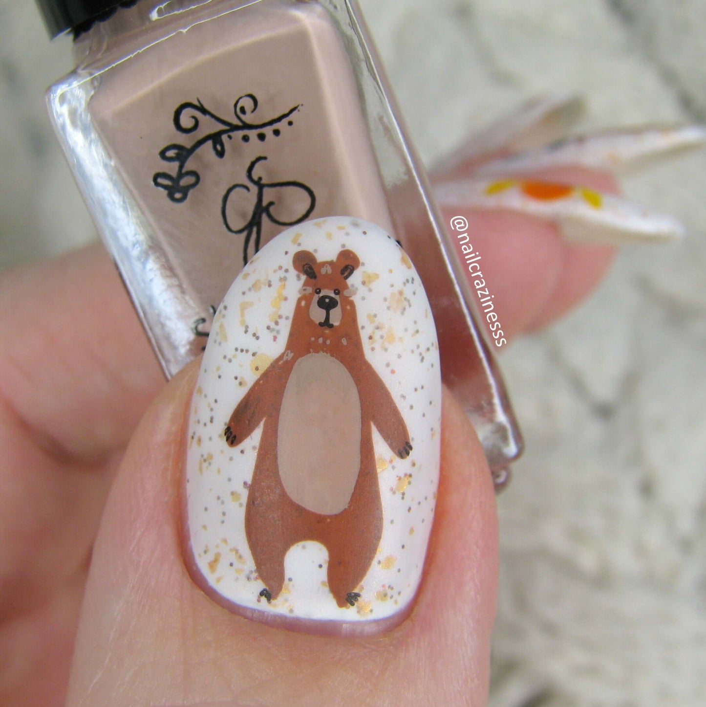 single-manicured-nail-showing-stamping-nail-art-of-a-bear