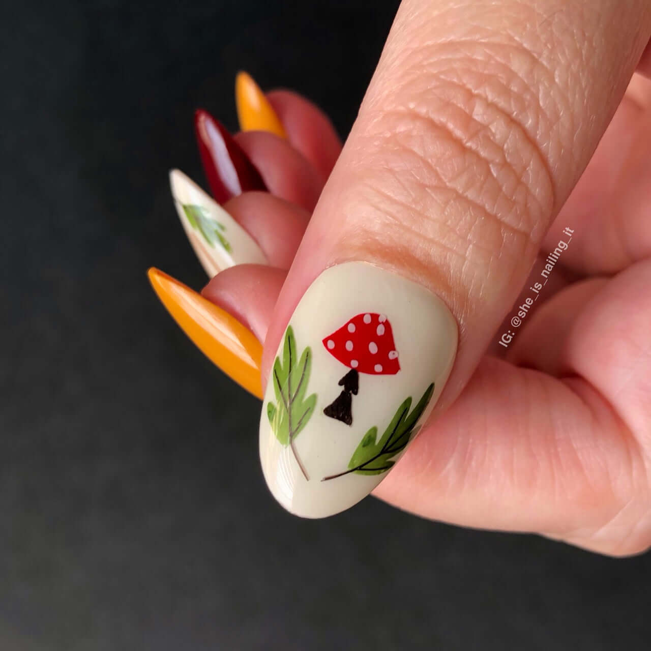 singled-manicure-nail-with-a-stamping-nail-art-design-of-a-mushroom-and-some-leaves