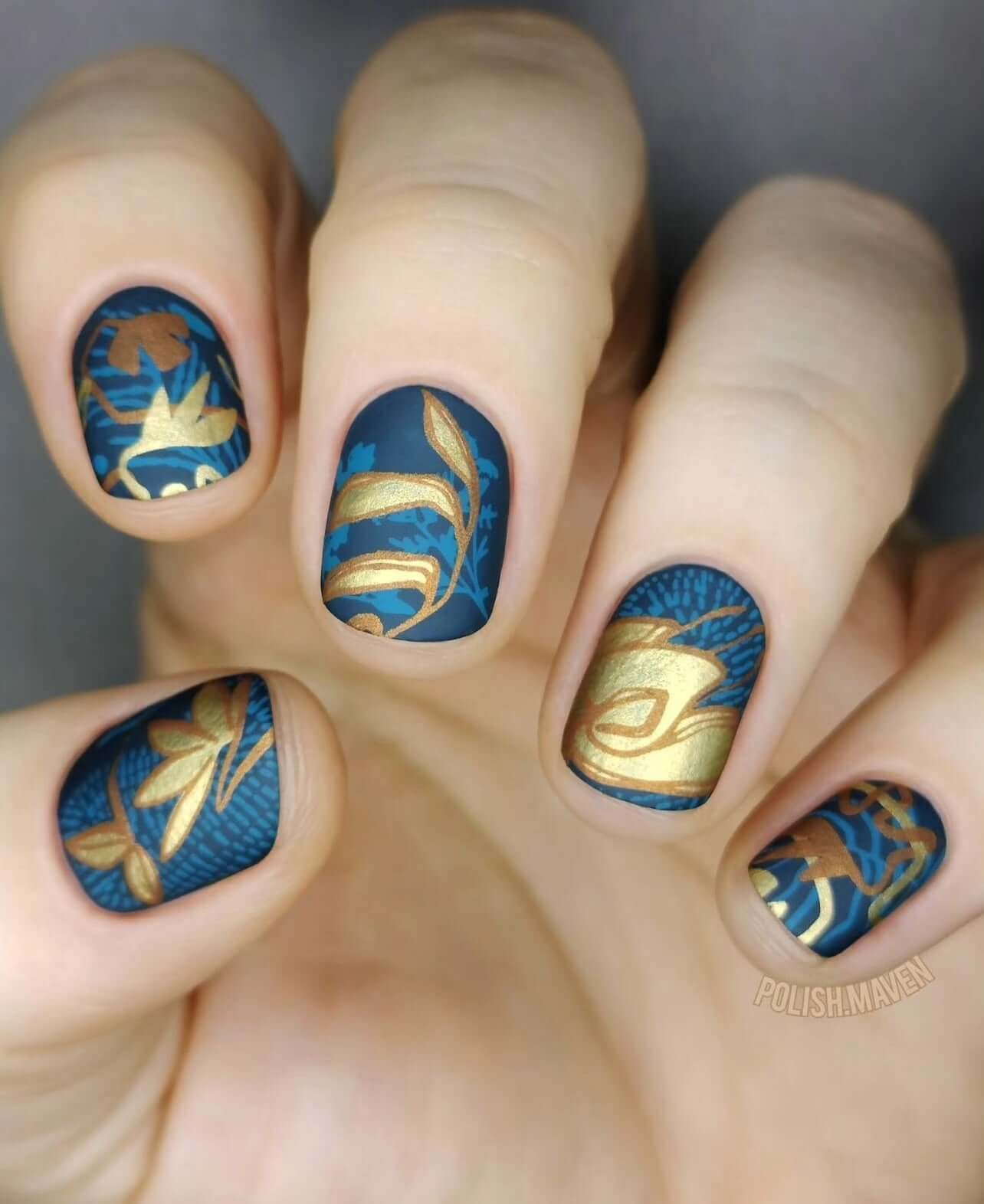 Manicure-showing-nail-art-designs-of-modern-boho-shapes-and-leaves