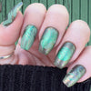 Manicure-showing-nail-art-designs-of-modern-boho-leaves-in-green-and-silver