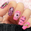 bright-pink-manicure-showing-floral-nail-art-designs-of-peonies-leaves-and-nail-art-words