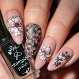 stunning-pale-pink-manicure-showing-floral-nail-art-designs