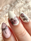 Soft-vintage-style-manicure-showing-nail-art-designs-of-roses-and-a-dragon-fly
