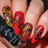 Striking-bright-red-yellow-and-orange-manicure-showing-zebra-and-cheetah-print-with-the-words-let's-get-wild