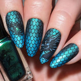 Beautiful-blue-shimmer-manicure-showing-nail-art-designs-of-dragon-scales-and-a-dragons-eye