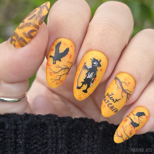 stunning-manicure-with-halloween-designs-of-a-scarecrow-branches-and-crows