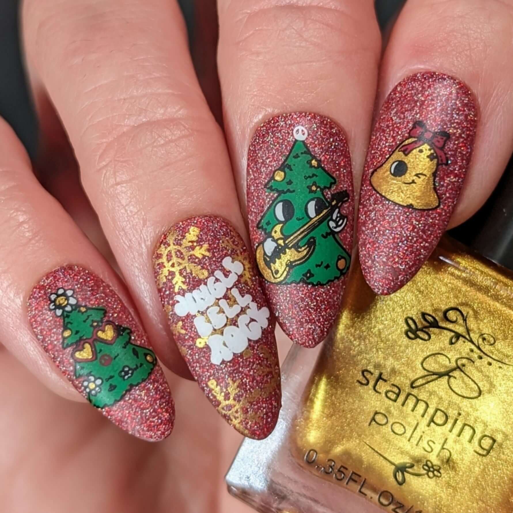 manicured-hand-with-cute-nail-art-designs-of-a-cartoon-christmas-trees-playing-guitar-and-the-words-jingle-bell-rock