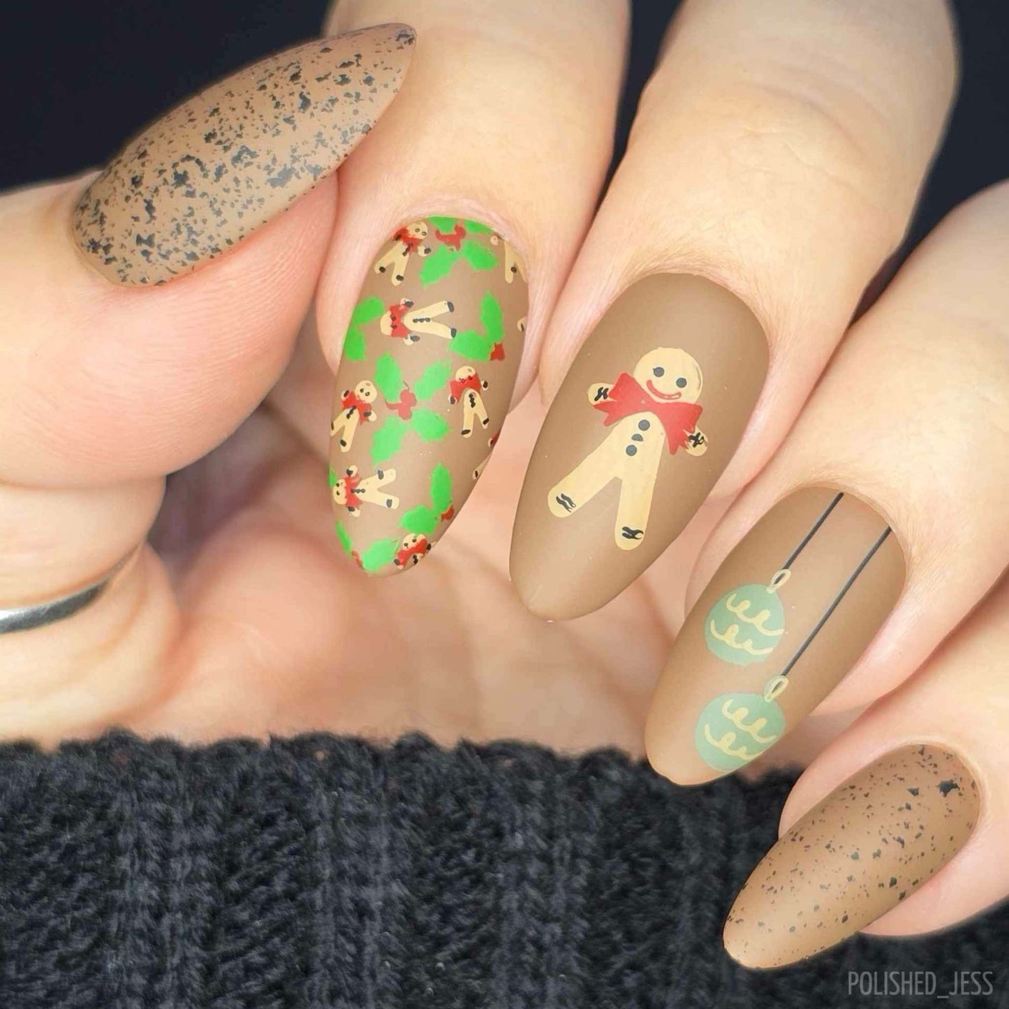stunning-festive-manicure-with-nail-art-designs-of-gingerbread-men-and-christmas-baubles