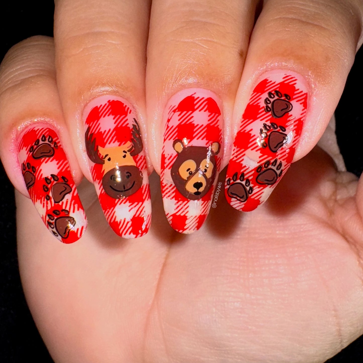 beautiful-manicure-showing-nail-art-plaid-design-with-a-bear-a-moose-and-paw-pints