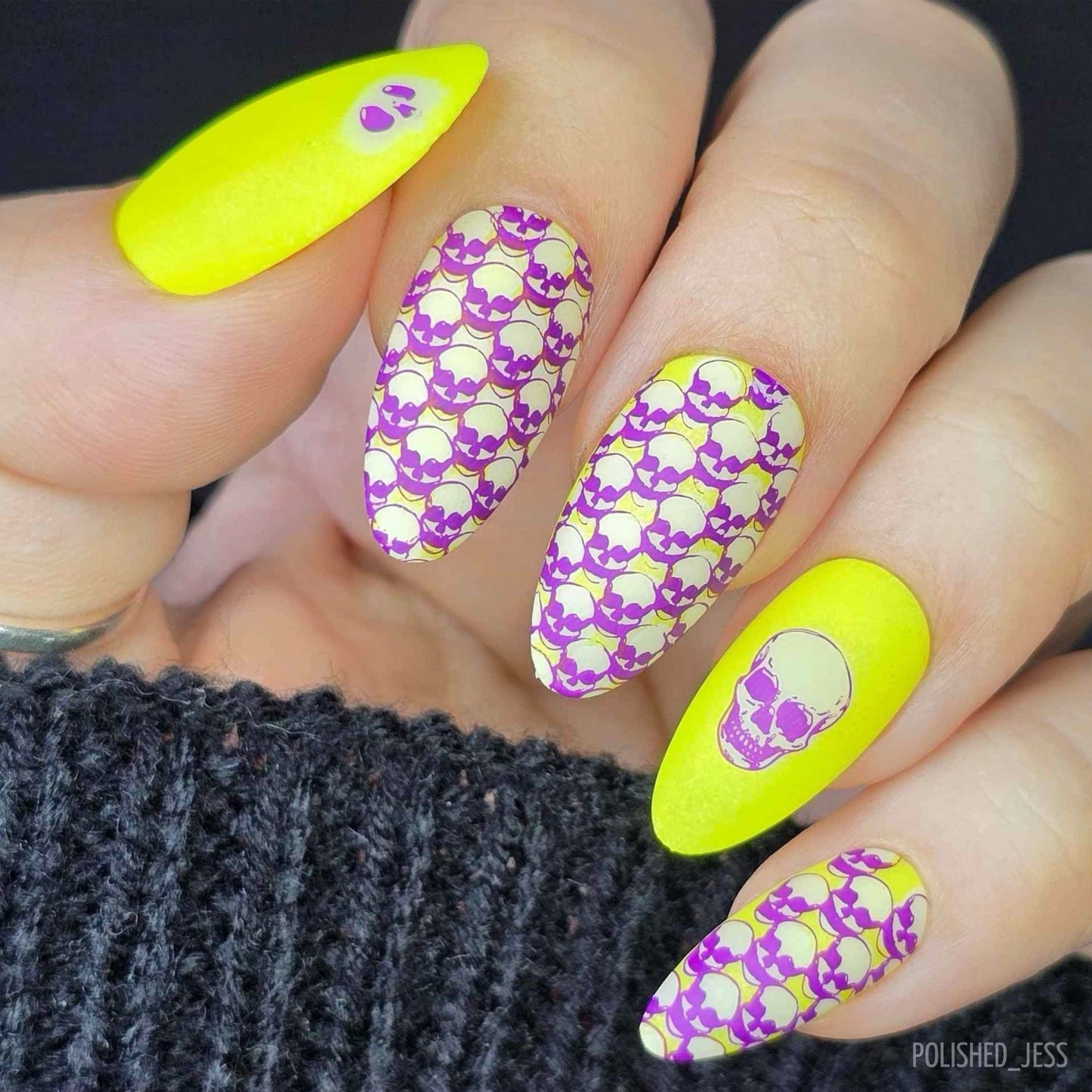 gorgeous-manicure-with-halloween-themed-nail-art-of-skulls