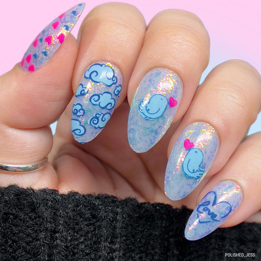 stunning-manciure-showing-nail-art-designs-of-clouds-and-birds-holding-hearts-in-their-beaks
