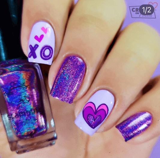manicure-showing-nail-art-designs-of-a-heart-and-letters-XO