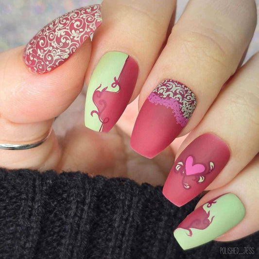 manicure-showing-nail-art-designs-of-swirls-and-a-hear-with-leaves