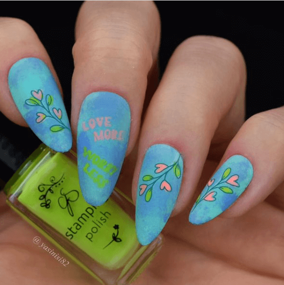 manicured-hand-holding-bottle-of-clear-jelly-stamper-stamping-polish