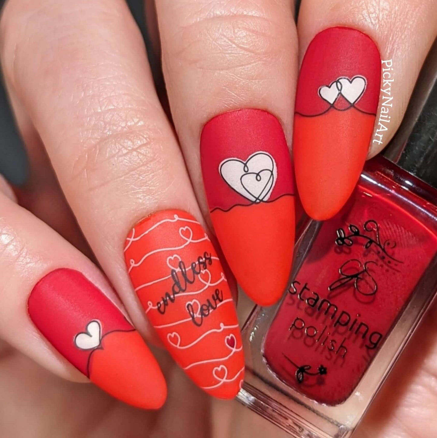 manicured-hand-with-bright-valentines-nail-art-designs-of-swirly-hearts-and-words-endless-love