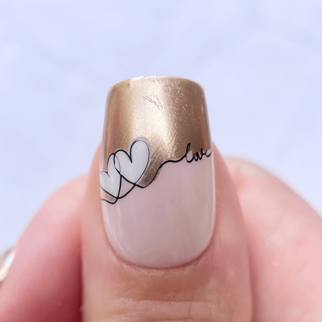 manicured-thumb-nail-with-stunning-french-tip-nail-art-designs-of-swirly-hearts-and-words-love