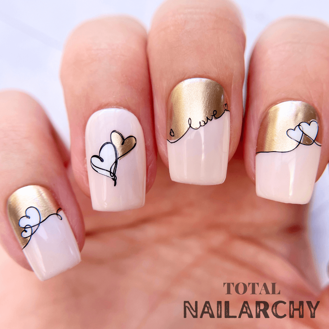 manicured-hand-with-stunning-french-tip-nail-art-designs-of-swirly-hearts-and-words-love