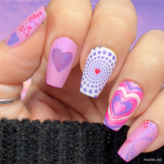 manicured-hand-with-stunning-valentines-nail-art-designs-of-hearts-in-different-patterns-and-sizes