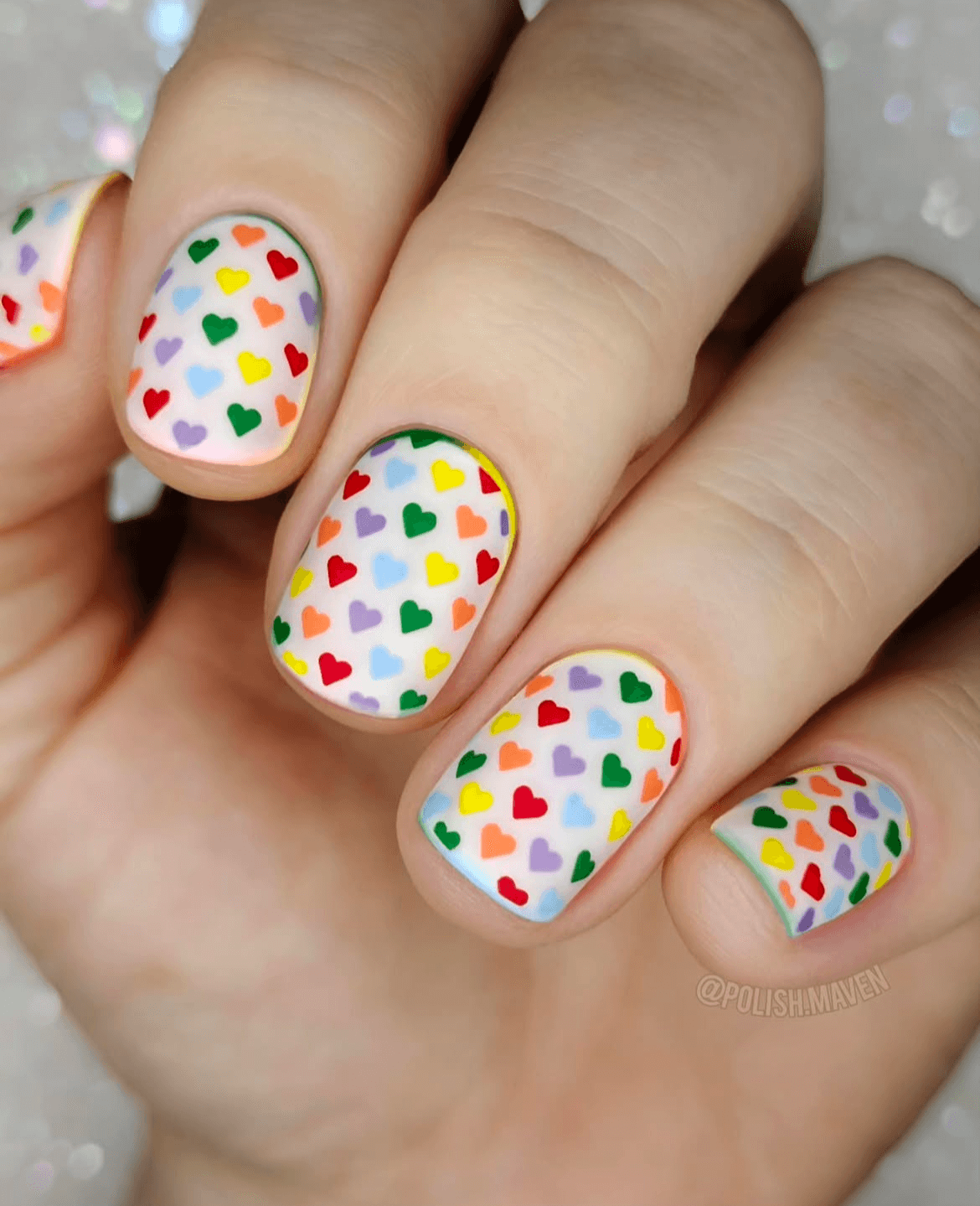 manicured-hand-with-stunning-full-coverage-mini-heart-nail-art