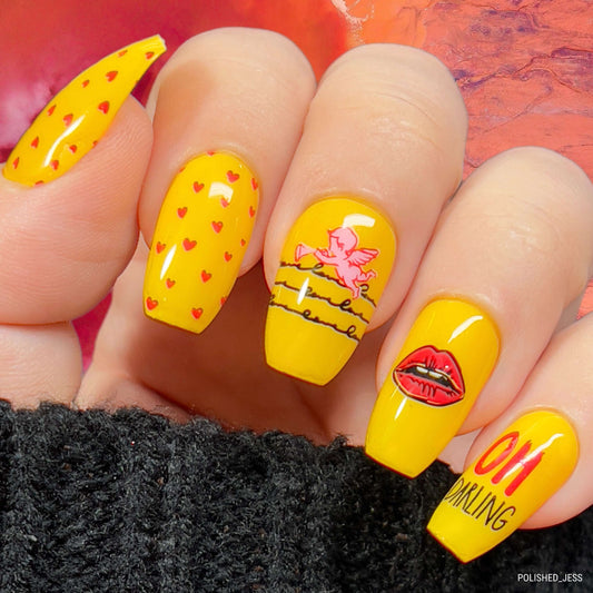 bright-manicured-hand-with-nail-art-designs-of-a-cherub-lips-hearts-and-words-oh-darling