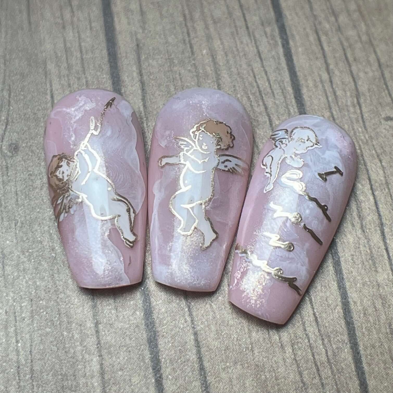 set-of-three-nail-tips-with-nail-at-designs-of-cherubs-and-the-words-i-love-you-so-much