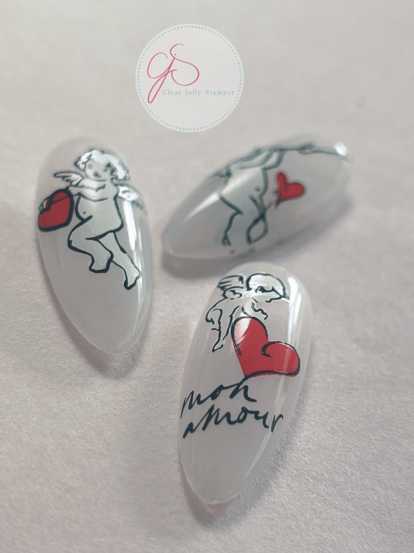 set-of-three-nail-tips-with-nail-at-designs-of-cherubs-and-the-words-mon-amour
