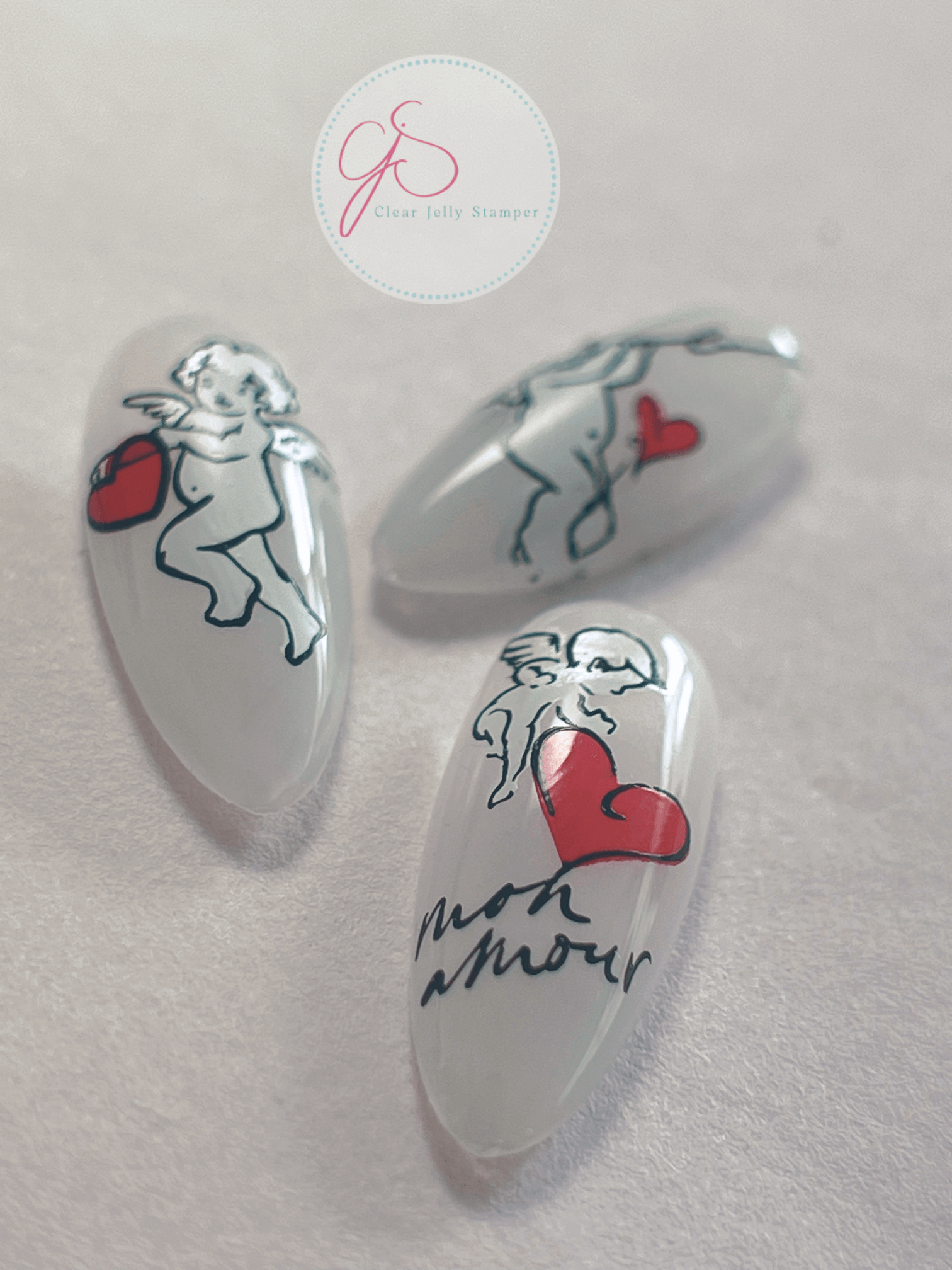 set-of-three-nail-tips-with-nail-at-designs-of-cherubs-and-the-words-mon-amour