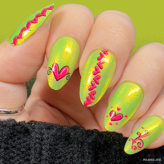 manicured-hand-with-nail-art-designs-of-hearts-and-swirls