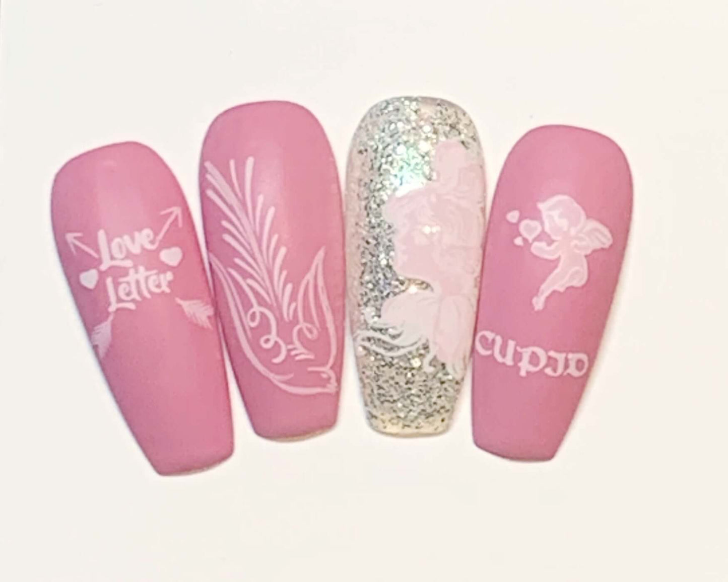 set-of-nail-tips-showing-valentines-themed-nail-art-designs-of-cupid-and-a-dove