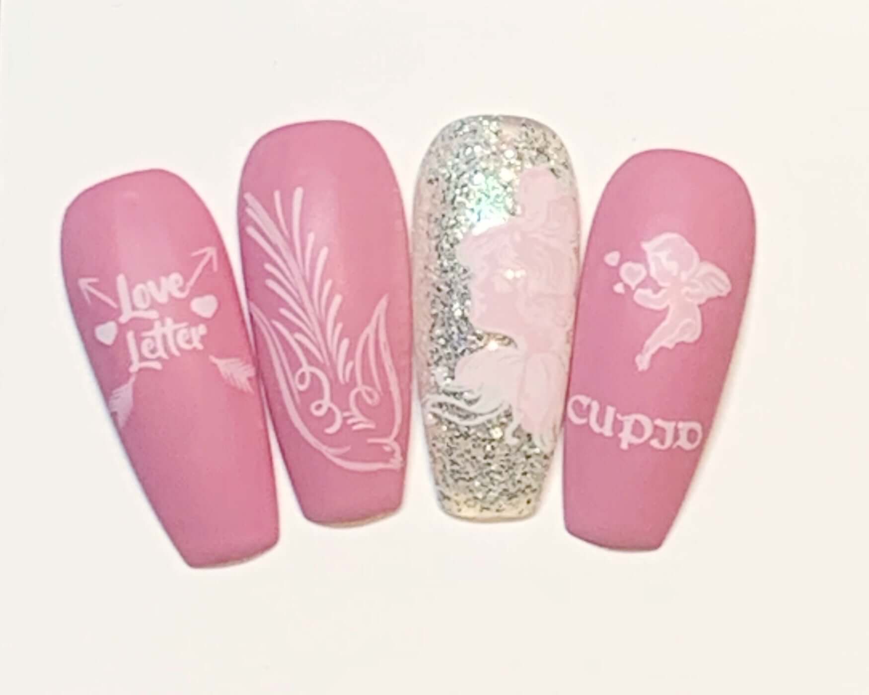set-of-nail-tips-showing-valentines-themed-nail-art-designs-of-cupid-and-a-dove