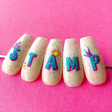 manicured-nail-tips-showing-fun-alphabet-nail-art-design-saying-stamp