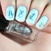 Light-blue-manicure-showing-the-letters-m-e-l-stamped-on-in-nail-art